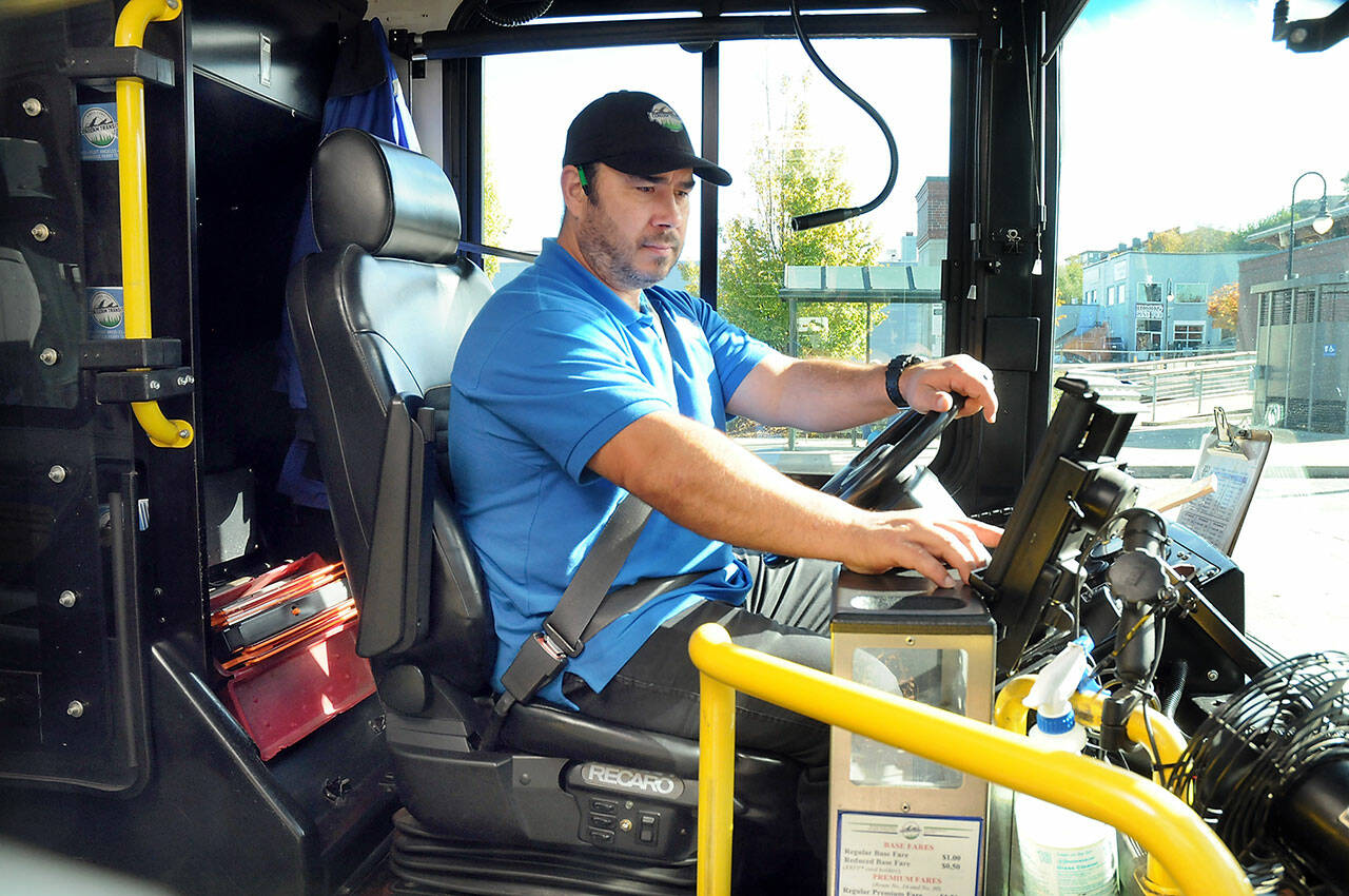 Photo by Keith Thorpe/Olympic Peninsula News Group
Clallam Transit driver Dante Ruiz prepares his bus for the 30 Route to Sequim on Oct. 18 at The Gateway transit center in Port Angeles.