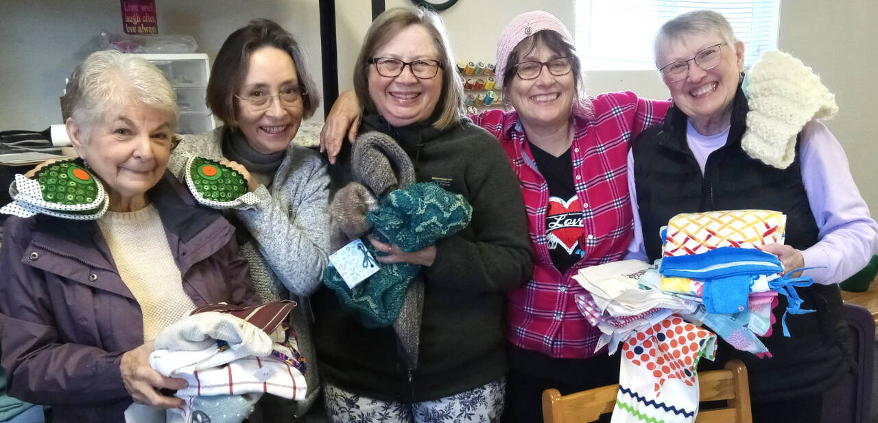 Photo courtesy of Dungeness Valley Lutheran Church / Dungeness Valley Lutheran Church crafters (from left) Amanda Beitzel, Karen Turner, Laura Campbell, Kathy Nichols and Myrna Juergens prepare items for the church’s annual Yuletide Bazaar, set for 9 a.m.-3 p.m. on Saturday, Nov. 18.