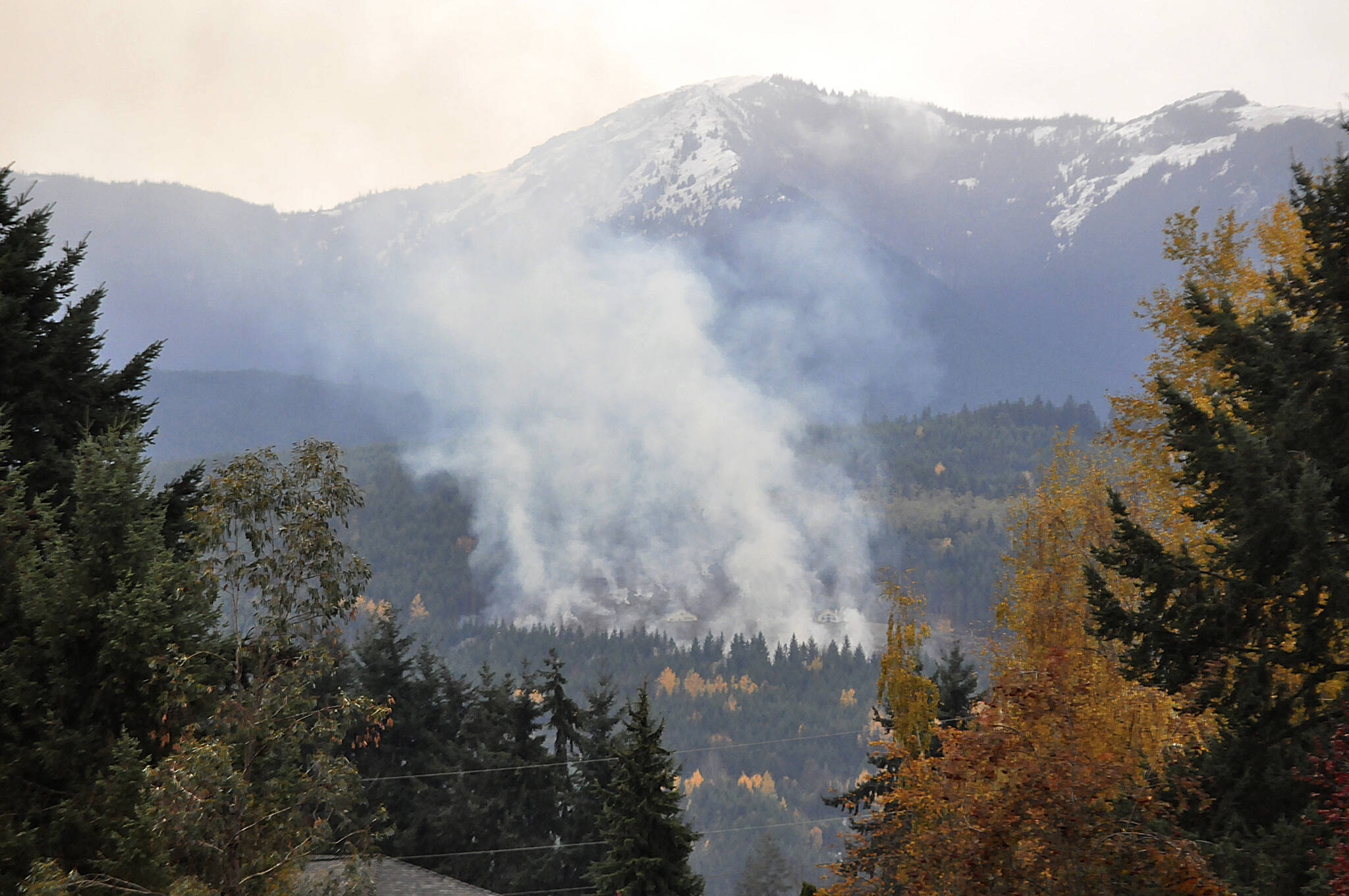 Sequim Gazette photo by Matthew Nash/ A slash pile fire was visible from the City of Sequim and across the Sequim area on Nov. 10. Clallam County Fire District 3 officials said several concerned citizens reported the fire, which was found to be legal and in control.