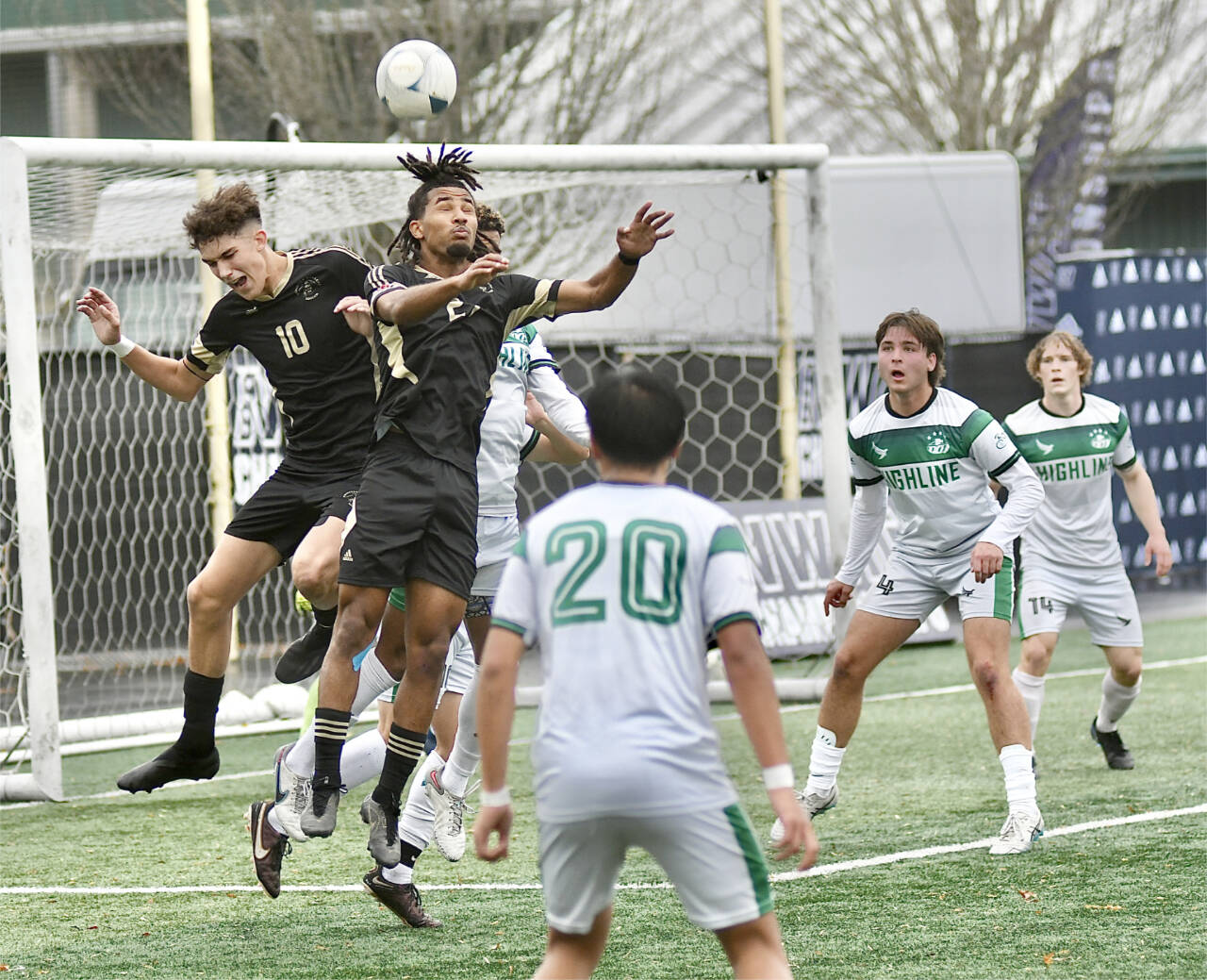 Photo by Jay Cline/Peninsula College
Peninsula College’s Nil Grau, left, and Abdurahim Leigh battle for a ball in front of the Highline net in the NWAC title game on Nov. 12 in Tukwila.