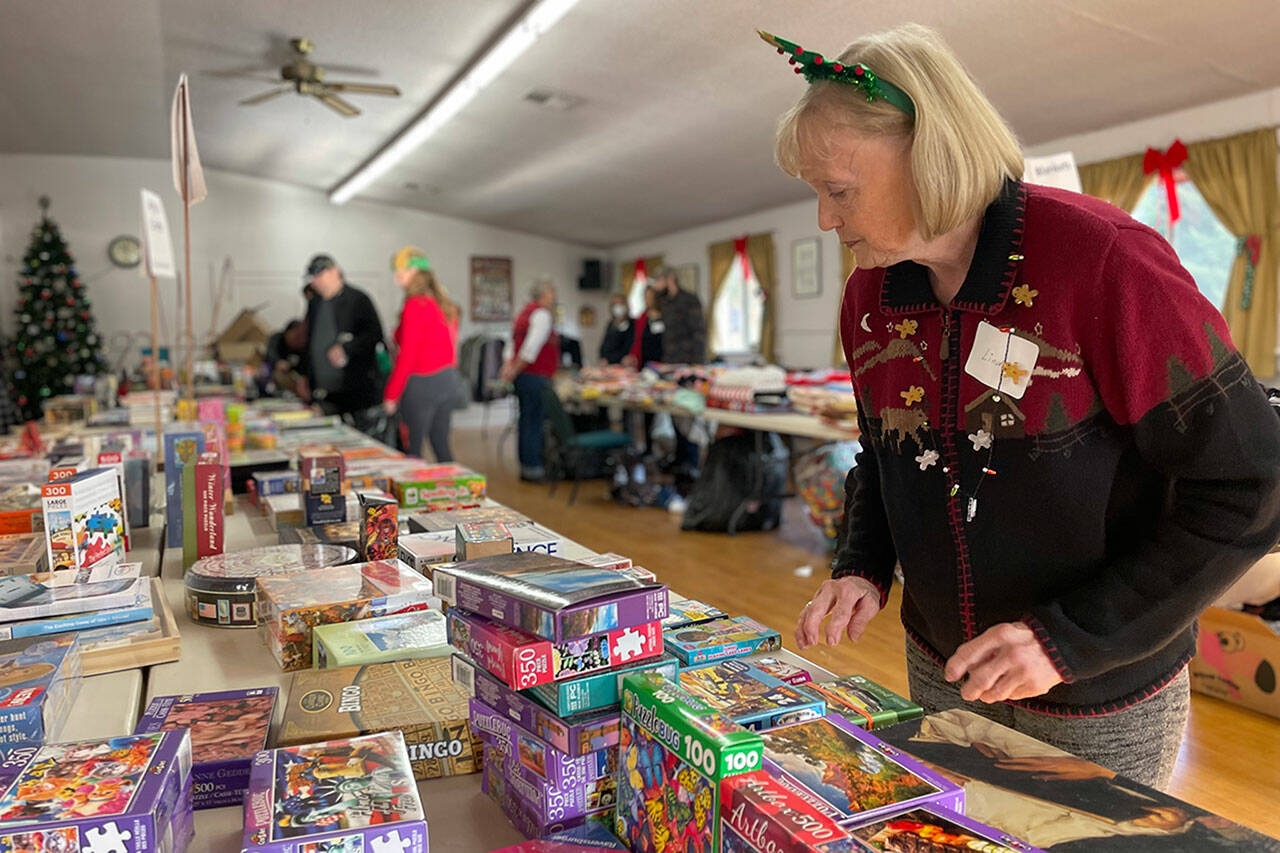 Sequim Gazette file photo by Matthew Nash
Volunteer Linda Richl organizes toys and games at Toys for Sequim Kids in Sequim Prairie Grange in 2022. This year’s event is set for Dec. 12 in the grange.