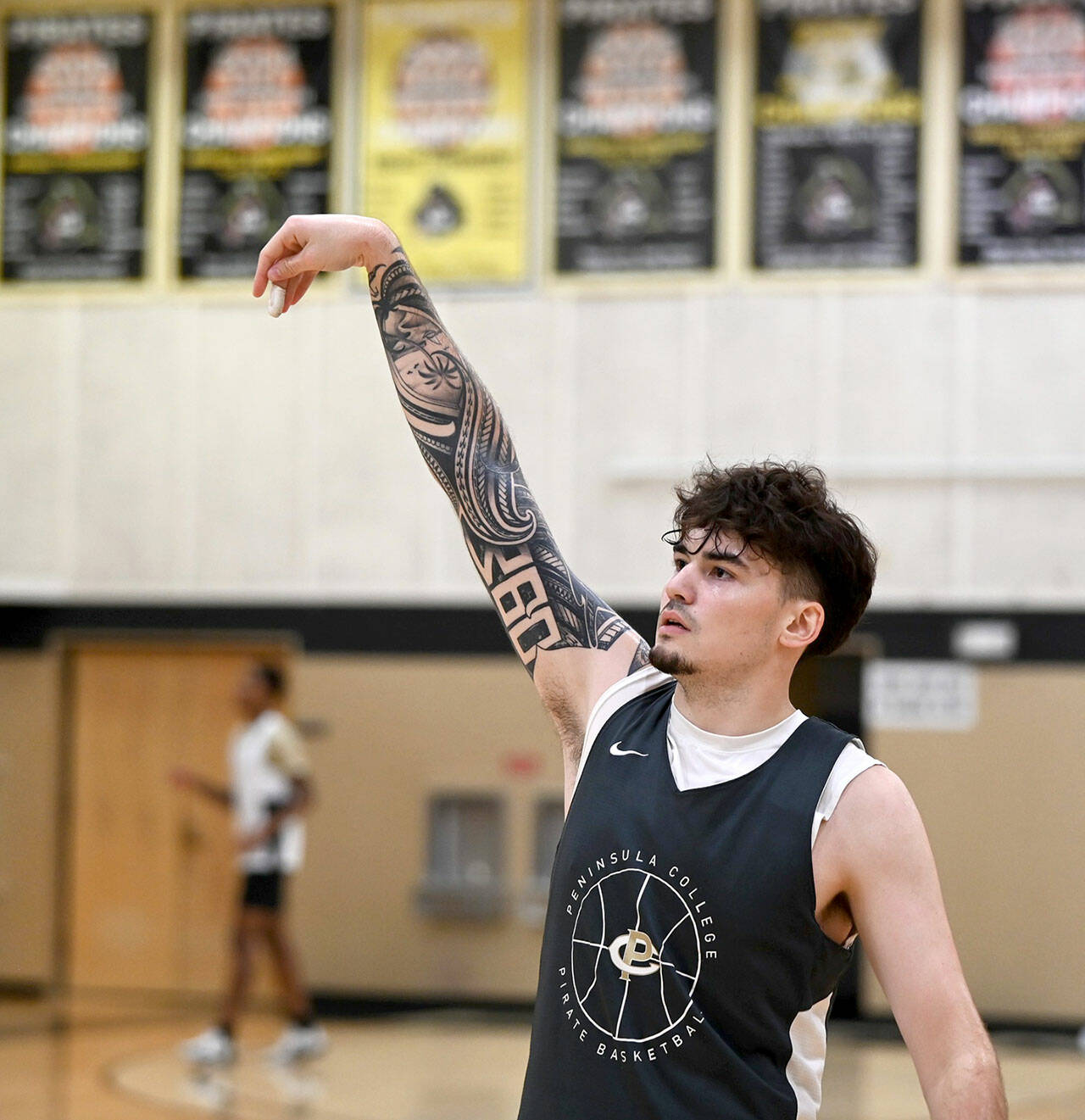 Photo courtesy of Peninsula College Athletics / Peninsula sophomore Aiden Olmstead follows through on a jump shot during a recent practice. Olmstead saw action as a freshman with the Pirates before an injury cut his 2022-23 season short.