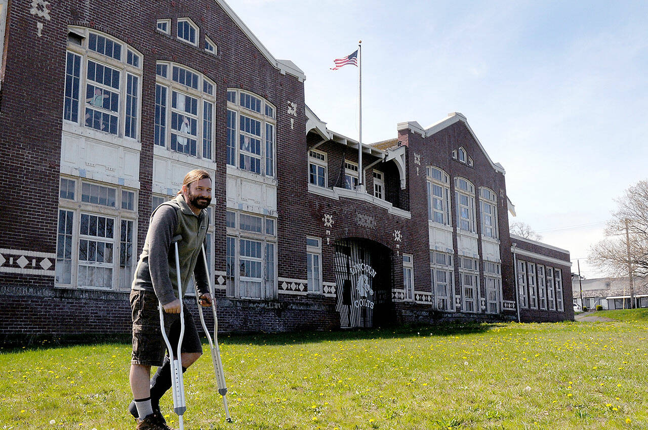File photos by Keith Thorpe/Olympic Peninsula News Group 
David Brownell, executive director of the North Olympic History Center, stands in front of the historic Lincoln School at Eighth and C streets in Port Angeles in April. The center had hoped to divest itself of the school building and issued a request for proposal on what to do with the structure, but after receiving no feasible offers its board decided in late November to demolish the structure.