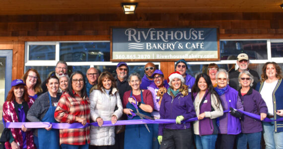 Photo by Monica Berkseth of Time Catcher Photography
Riverhouse Bakery & Café owner Denise Ferguson (center) celebrates a ribbon-cutting at the newly-opened eatery with members of the Sequim-Dungeness Chamber of Commerce.