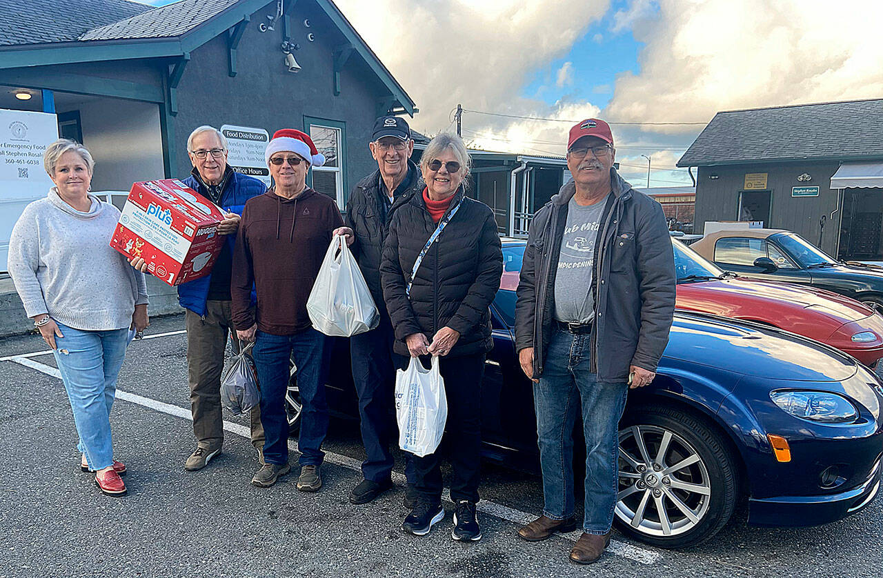 Photo courtesy Sequim Food Bank
Members of the Olympic Peninsula Chapter of Club Miata Northwest donate food, diapers, and money to the Sequim Food Bank. Pictured, from left, are Sequim Food Bank Executive Director Andra Smith, and club members Tom Davies, Jim Ragan, Barry Halsted, Tracy Halsted and Tom Clark.