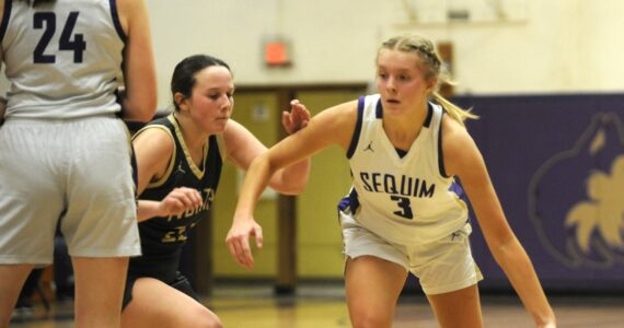 Sequim’s Jolene Vaara, right, drives to the basket in the first half of the Wolves’ 56-40 win over North Kitsap on Dec. 15.