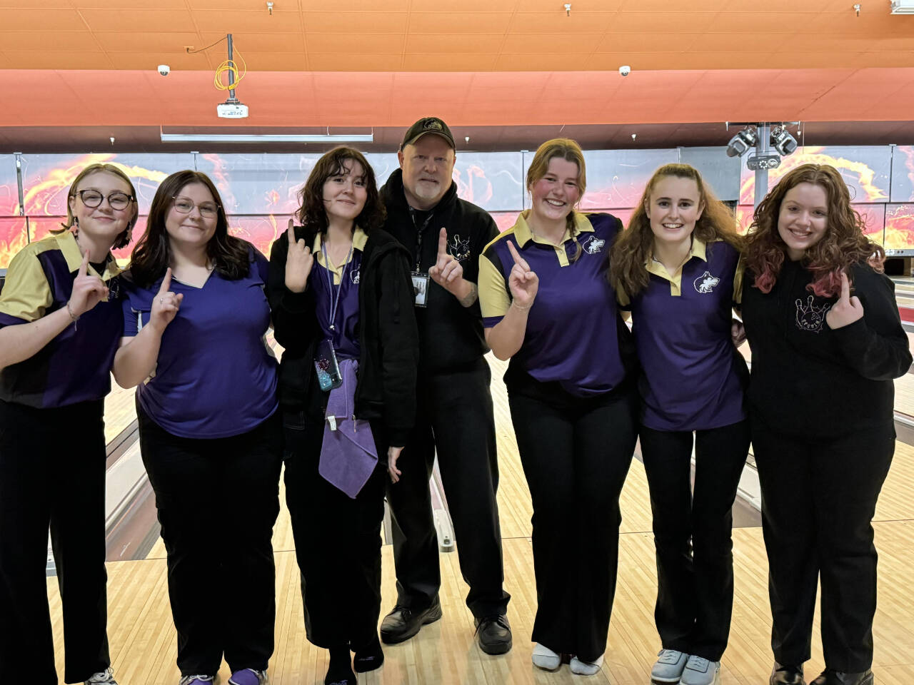 Photo courtesy of Randy Perry/Sequim Wolves Bowling
League champs! Sequim High School’s bowling team celebrates the program’s first Olympic League title on Jan. 18 in Silverdale. Pictured, from left, are Kimberly Heintz, Morgan Kayser, Victoria Nava, head coach Randy Perry, Skylar Kryzworz, Nikoline Updike and Cooper Hiatt.