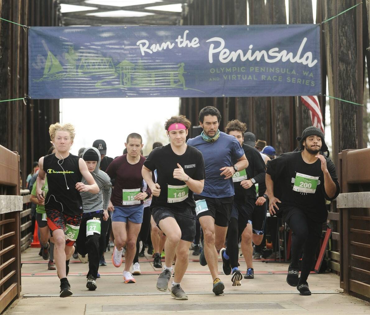 Sequim Gazette file photo by Michael Dashiell / About 300 runners take off in the Run the Peninsula’s Sequim Railroad Bridge run in April 2023.