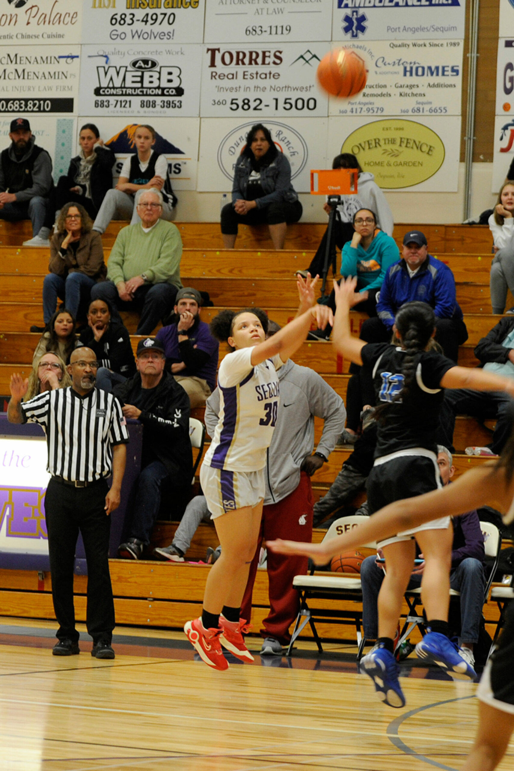 Sequim Gazette photo by Matthew Nash/ Bobbi Mixon shoots and sinks one of her game high six three-pointers on Jan. 26 at home against North Mason.