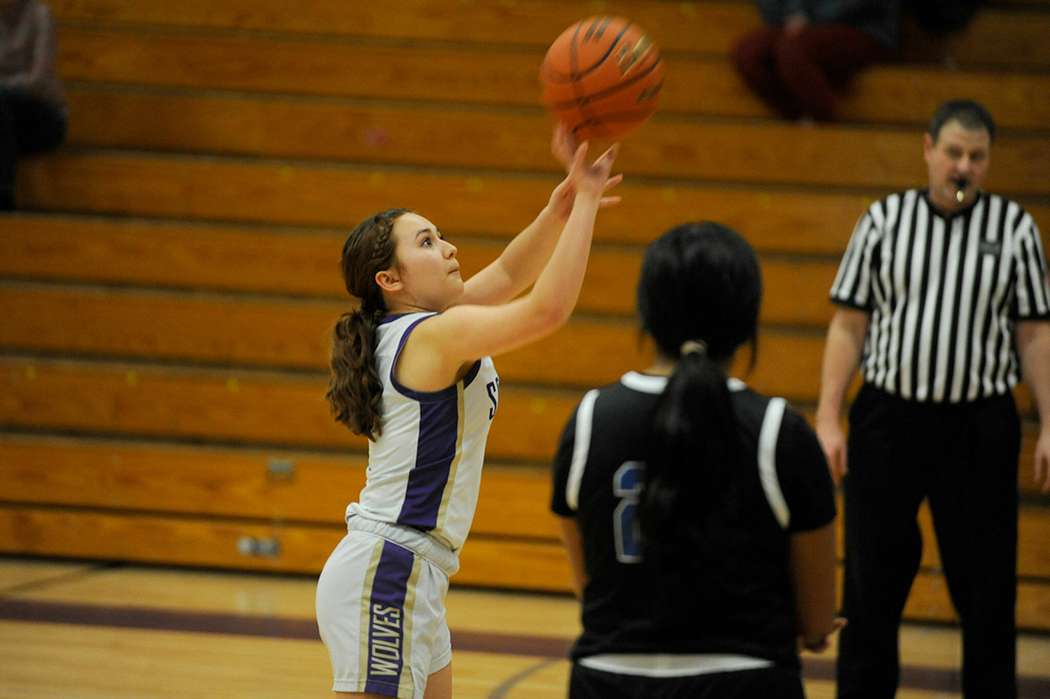 Sequim Gazette photo by Matthew Nash/ Sydney Thomas-Harris shoots one of three free throws as a substitute for teammate Libby Turella after she was poked in the eye during a play. Sequim won 73-66 over North Mason.