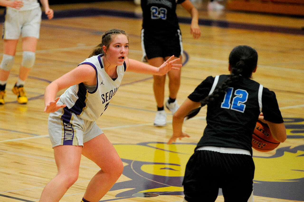 Sequim Gazette photo by Matthew Nash/ Sequim’s Hailey Wagner guards North Mason’s Adrianne Tupolo as she brings the ball up the court on Jan. 26.