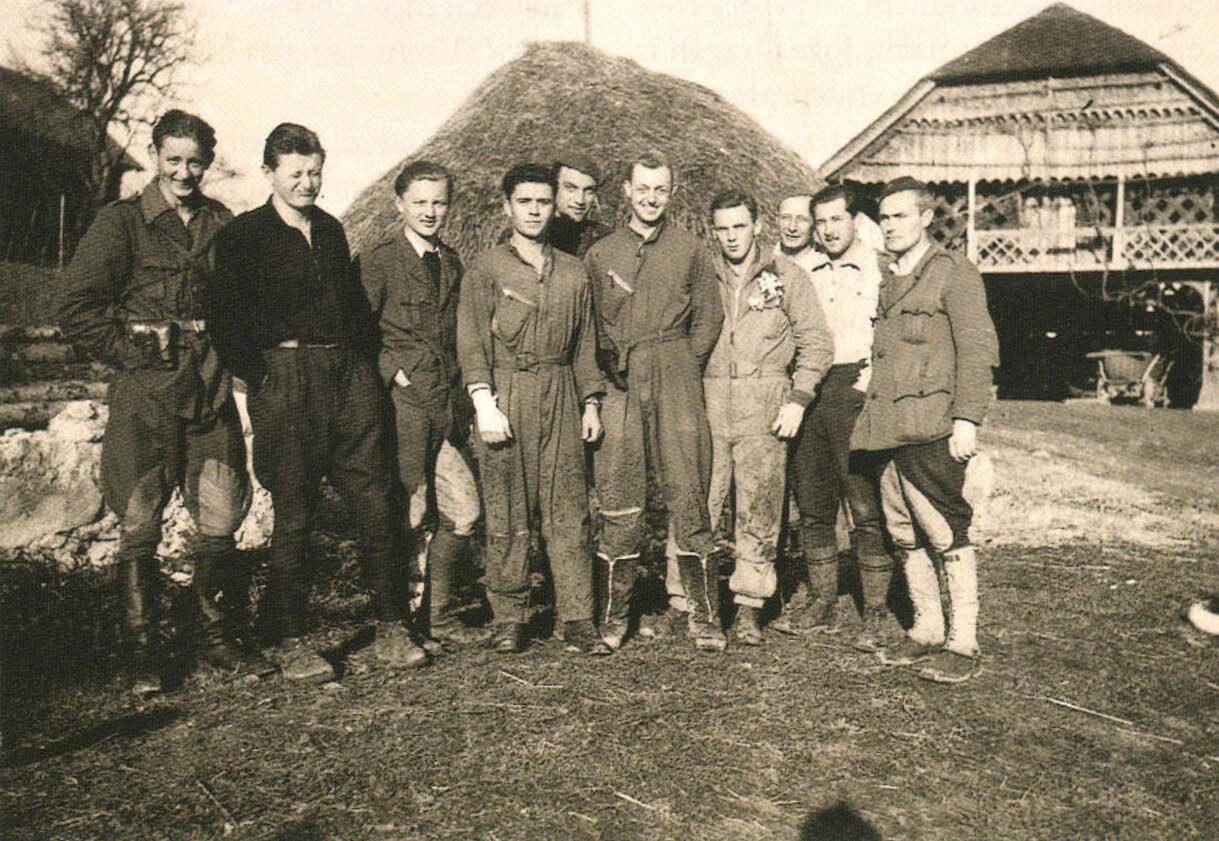 Photo courtesy of Steve Nordwell / Three American airmen among Partisans near Crnomelj, Slovenia. At far left is Lt. Lowell West, and third from left iZelezniki, Slovenia: Monument to the Partisan Battle of Dražgošes Ernie Nordwell.