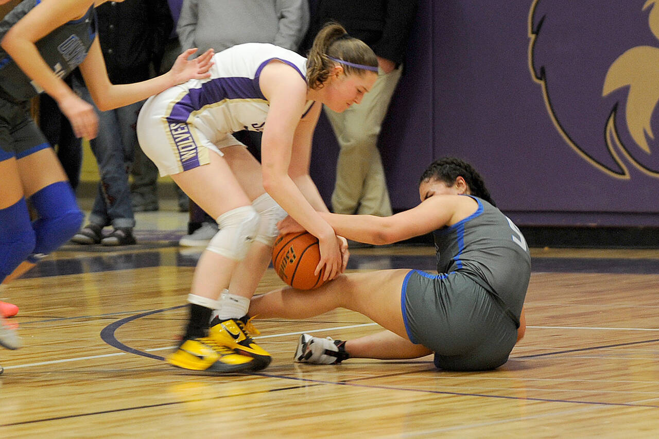 Sequim Gazette photo by Matthew Nash/ Libby Turella fights for the ball on Feb.1 against an Olympic player.