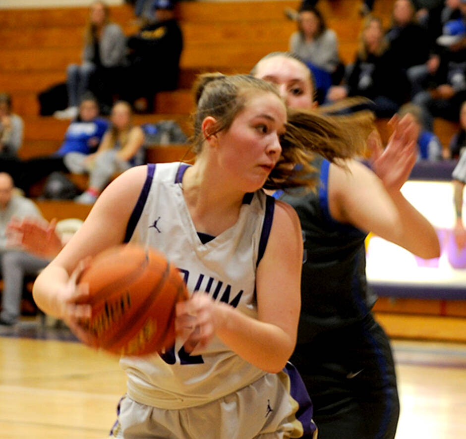 Sequim Gazette photo by Matthew Nash/ Hailey Wagner looks for positioning along the baseline against an Olympic player on Feb. 1.