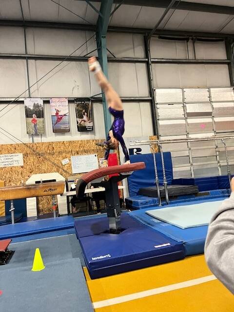 Photo courtesy of Rachel Sharp / Sequim’s Susannah Sharp competes in the vault at a Jan. 27 meet against Kingston and North Kitsap. Sharp’s 8.7 mark in the event earned her first place.