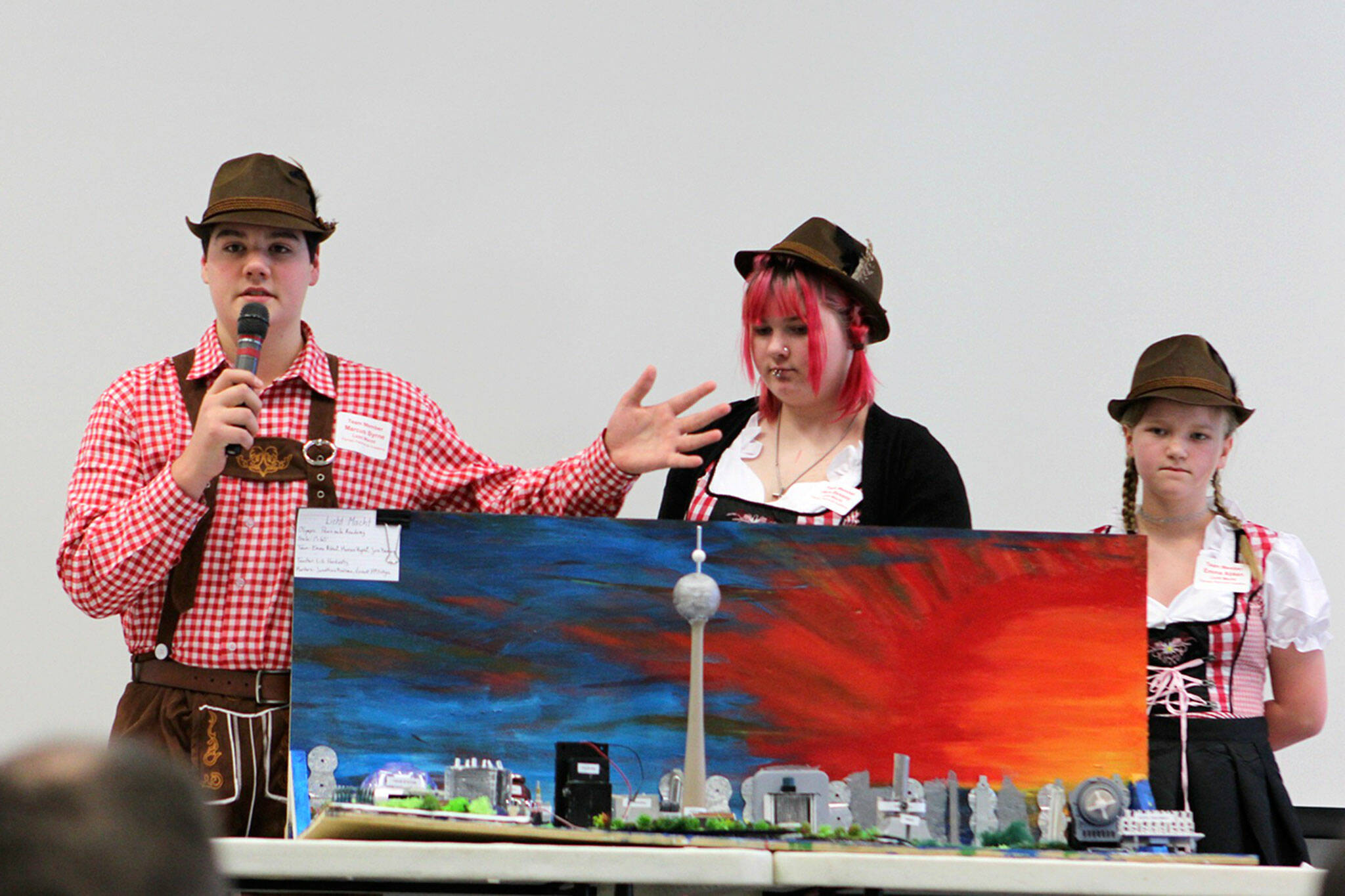 Photo courtesy Washington State Future City Regional Competition/ Team “Licht Macht,” from left, Marcus Byrne, Jera Bradley and Emma Abken present their city to judges in January for the Future City Regional Competition. They placed fifth overall.
