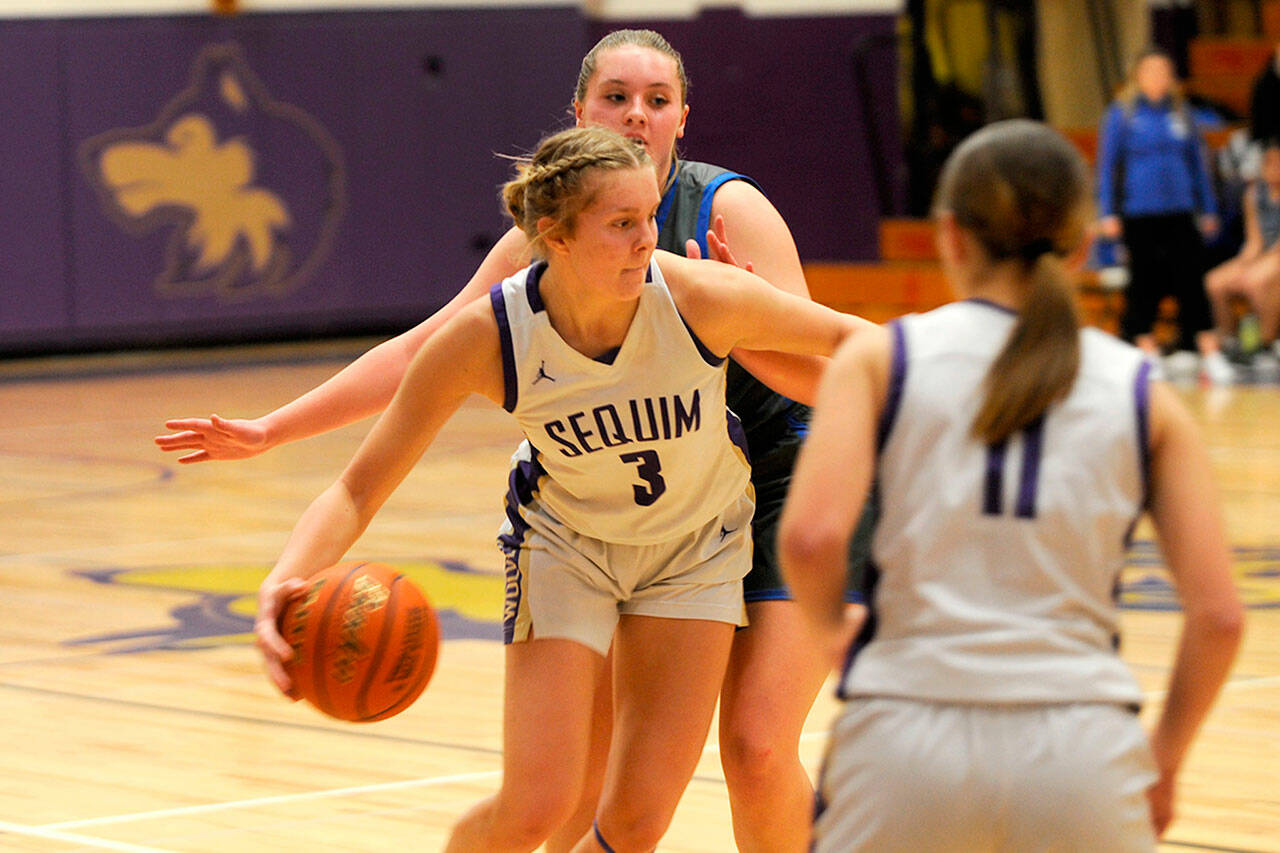 Sequim Gazette photo by Matthew Nash/ Jolene Vaara drives past an Olympic defender on Feb. 1 to dish out one of her game-high 10 assists.