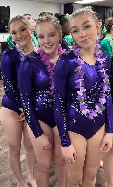 Photo courtesy of Rachel Sharp
From left, Sequim High gymnasts Madison Ripley, Lucy Spelker and Susannah Sharp are moving on to districts after posting qualifying scores at a Feb. 8 sub-district meet.
