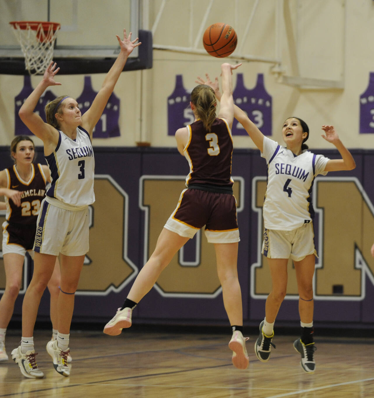 Sequim Gazette file photo by Michael Dashiell / Sequim’s Jolene Vaara (3) and Gracie Chartraw (4) defend the basket at Enumclaw’s Kalee Swanson passes to teammate Ava Smith in a bi-district tournament game on Feb. 14 in Sequim. Vaara was selected the Olympic League’s Most Valuable Player and Defensive Player of the Year while Chartraw was named to the all-league first team.