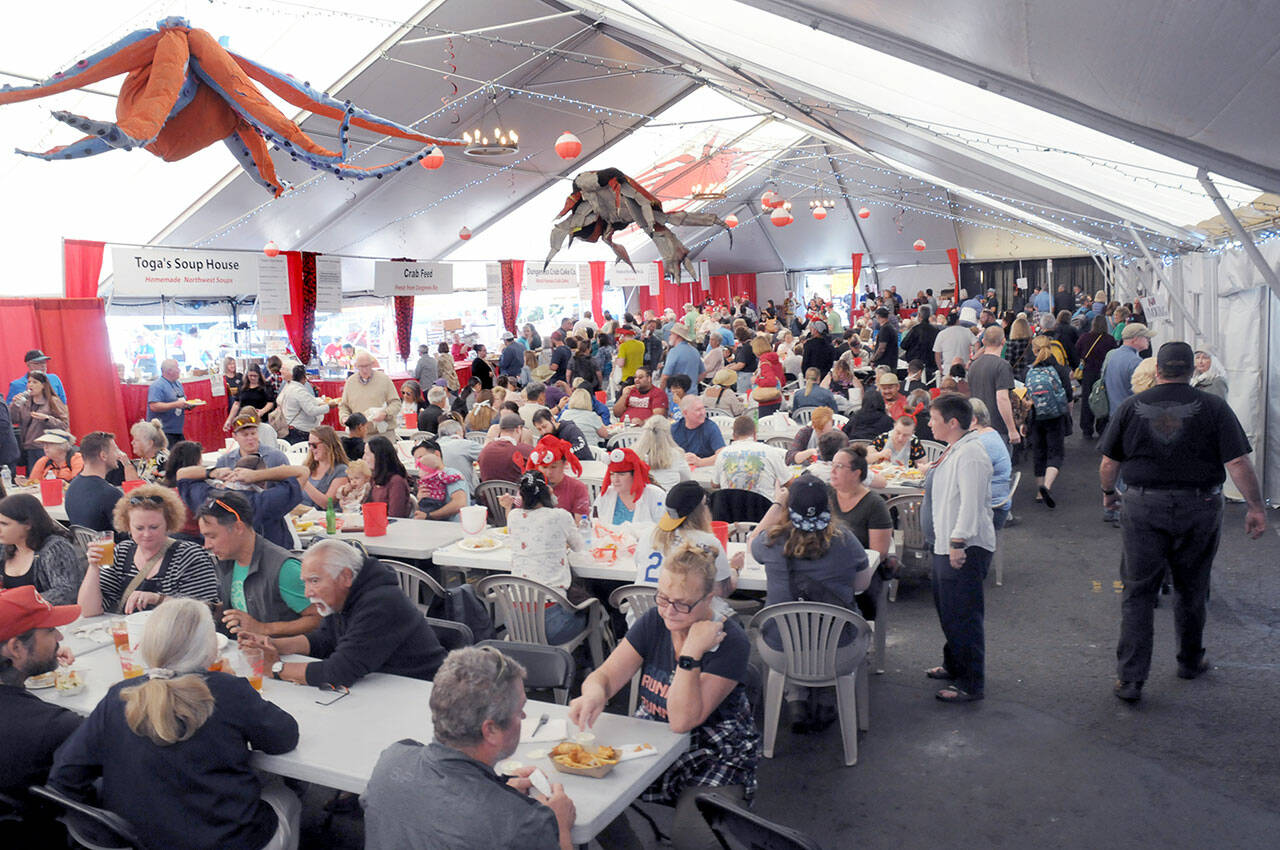 File photo by Keith Thorpe/Olympic Peninsula News Group
Crowds pack the main dining tent at the Dungeness Crab and Seafood festival near the Port Angeles waterfront in 2022.