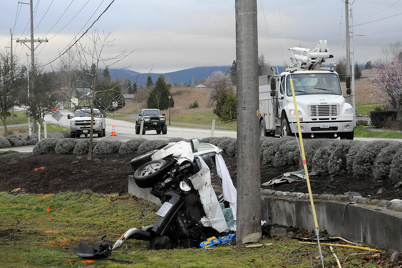 Sequim Gazette photo by Matthew Nash/ A man struck a power pole late on March 11 causing power to go out for nearly 2,000 households near West Sequim Bay Road through the early morning on March 12. He was not hospitalized.