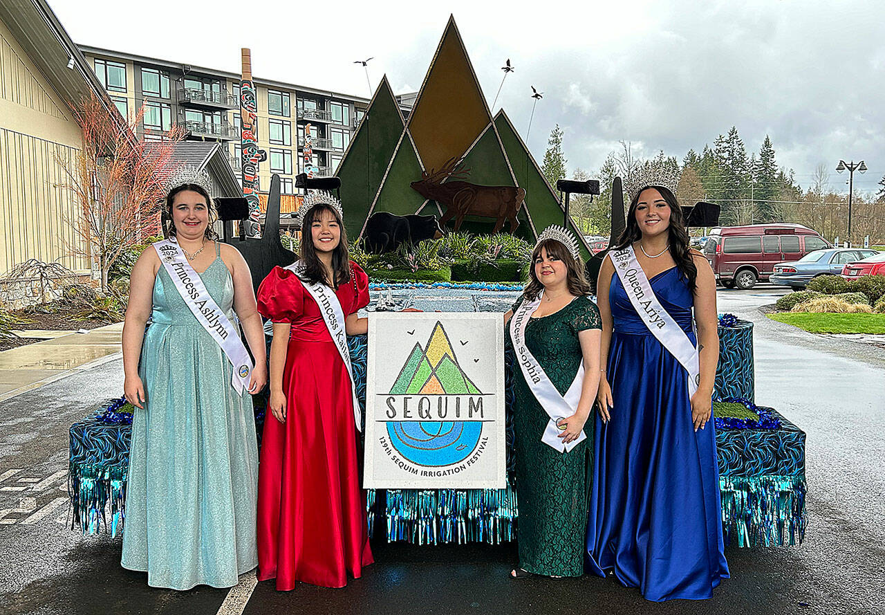 Sequim Gazette photo by Matthew Nash
Sequim Irrigation Festival royalty, from left, Princess Ashlynn Northaven, Princess Kailah Blake, Princess Sophia Treece, and Queen Ariya Goettling stand with their new float that they’ll ride on for 14 parades this year. It was shown to them for the first time on March 23 at 7 Cedars Casino.