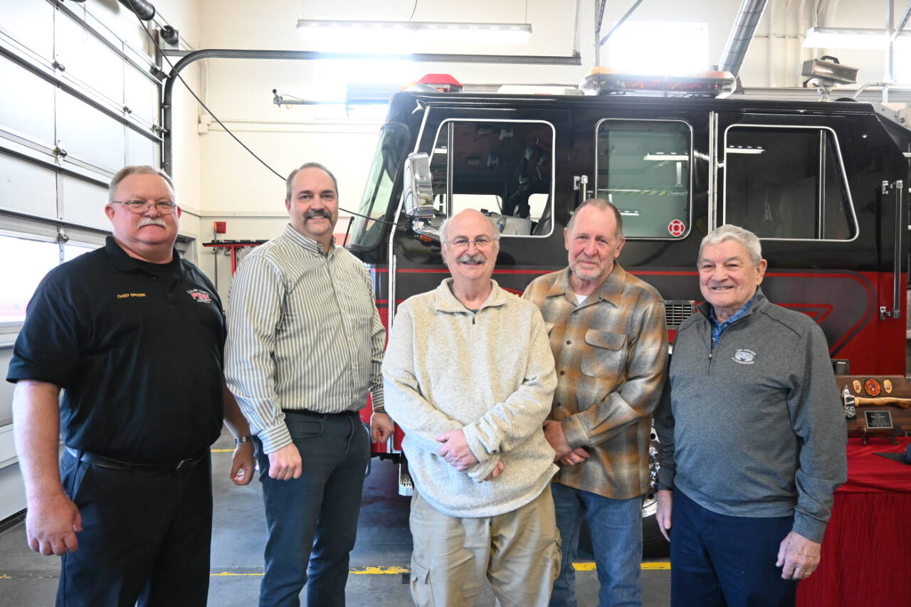 Sequim Gazette photo by Michael Dashiell / The current and former fire chiefs with Clallam County Fire District 3 gather on March 27 to send off outgoing chiefs Ben Andrews and Dan Orr. Pictured, from left, are: current District3 chief Justin Grider; Andrews; former chief Steve Vogel; Orr, and former chief Tom Lowe.