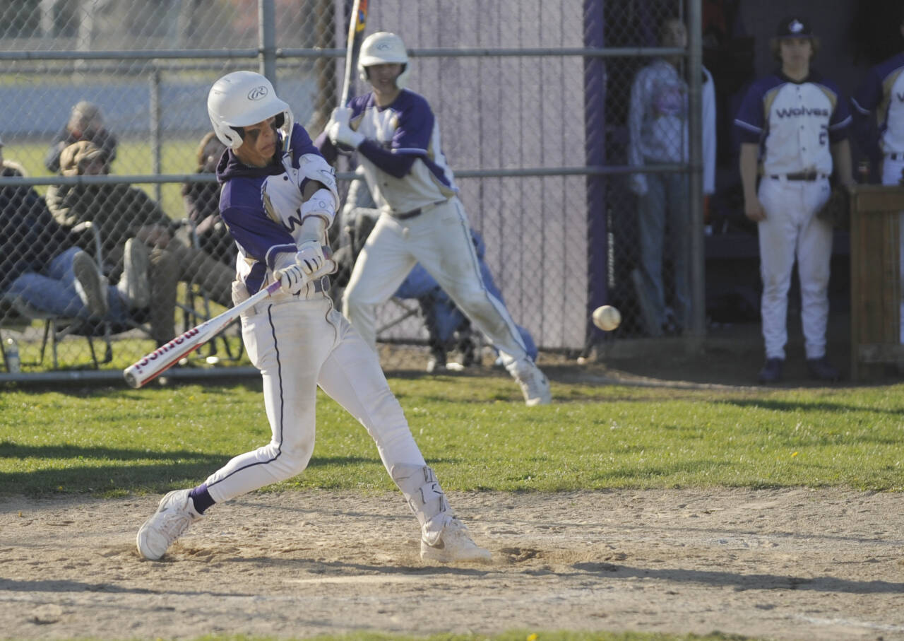 Sequim Gazette photo by Michael Dashiell / Sequim’s Bryant Laboy turns on a pitch for a single in the Wolves’ 7-4 home loss to rival Port Angeles on April 12. Laboy was 2-for-4 with a double and RBI in the contest.