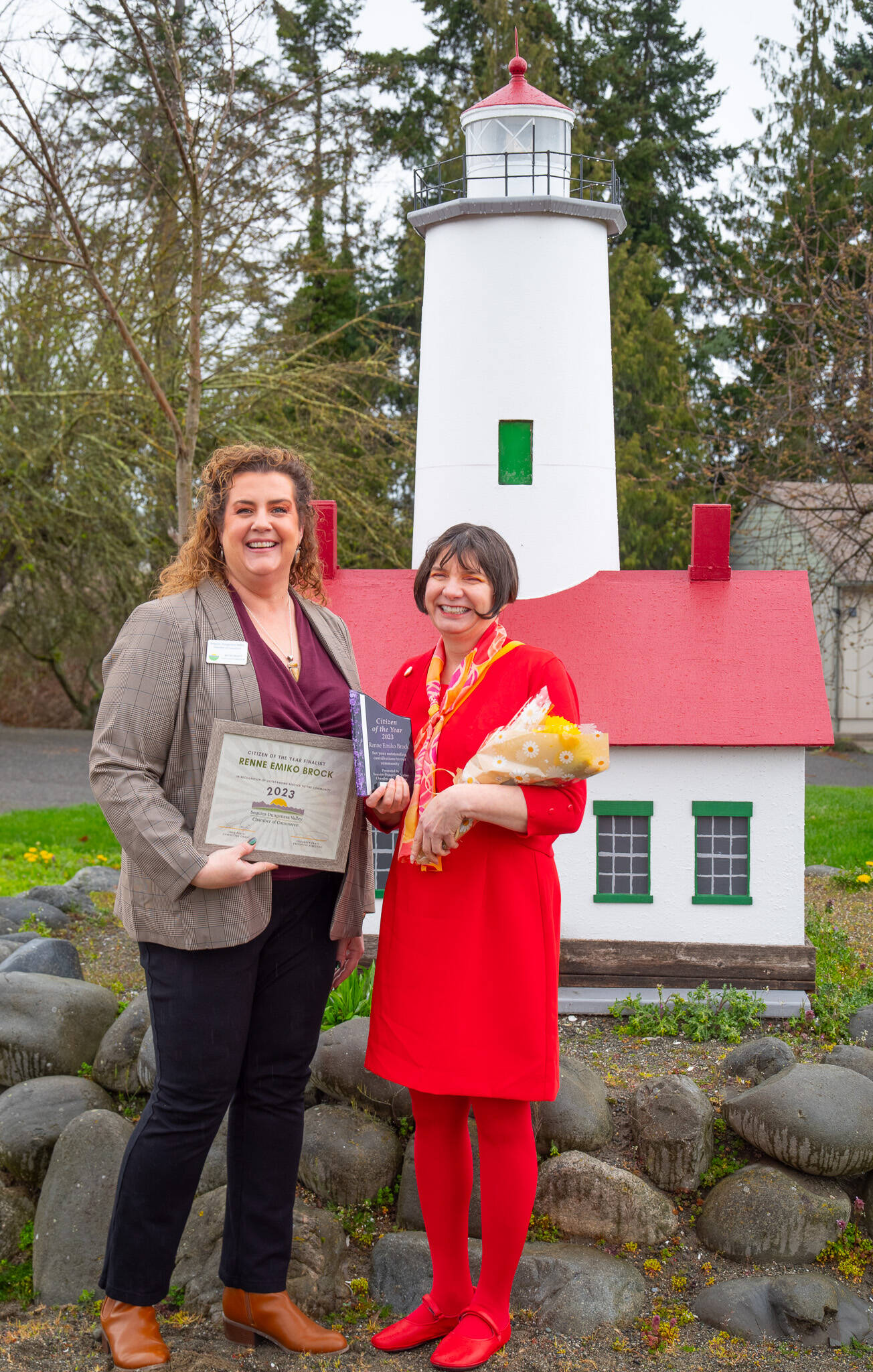 Beth Pratt, executive director of the Sequim-Dungeness Chamber of Commerce, presents Renne Emiko Brock with her 2023 Citizen of the Year award, which Pratt says is “built around celebrating volunteerism and the spirit of collaborations.”
