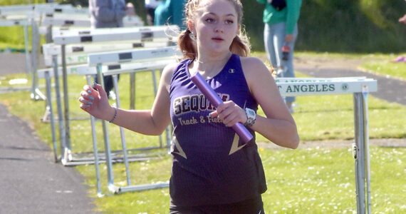 KEITH THORPE/PENINSULA DAILY NEWS
Sequim's Bailey Stein crosses the finish line on the anchor leg of the girls' 4x200 race on Thursday at Port Angeles High School.