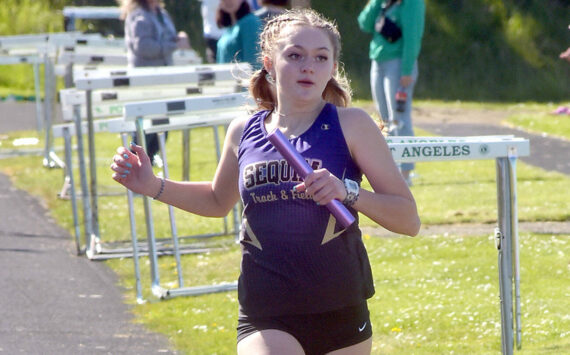 KEITH THORPE/PENINSULA DAILY NEWS
Sequim's Bailey Stein crosses the finish line on the anchor leg of the girls' 4x200 race on Thursday at Port Angeles High School.