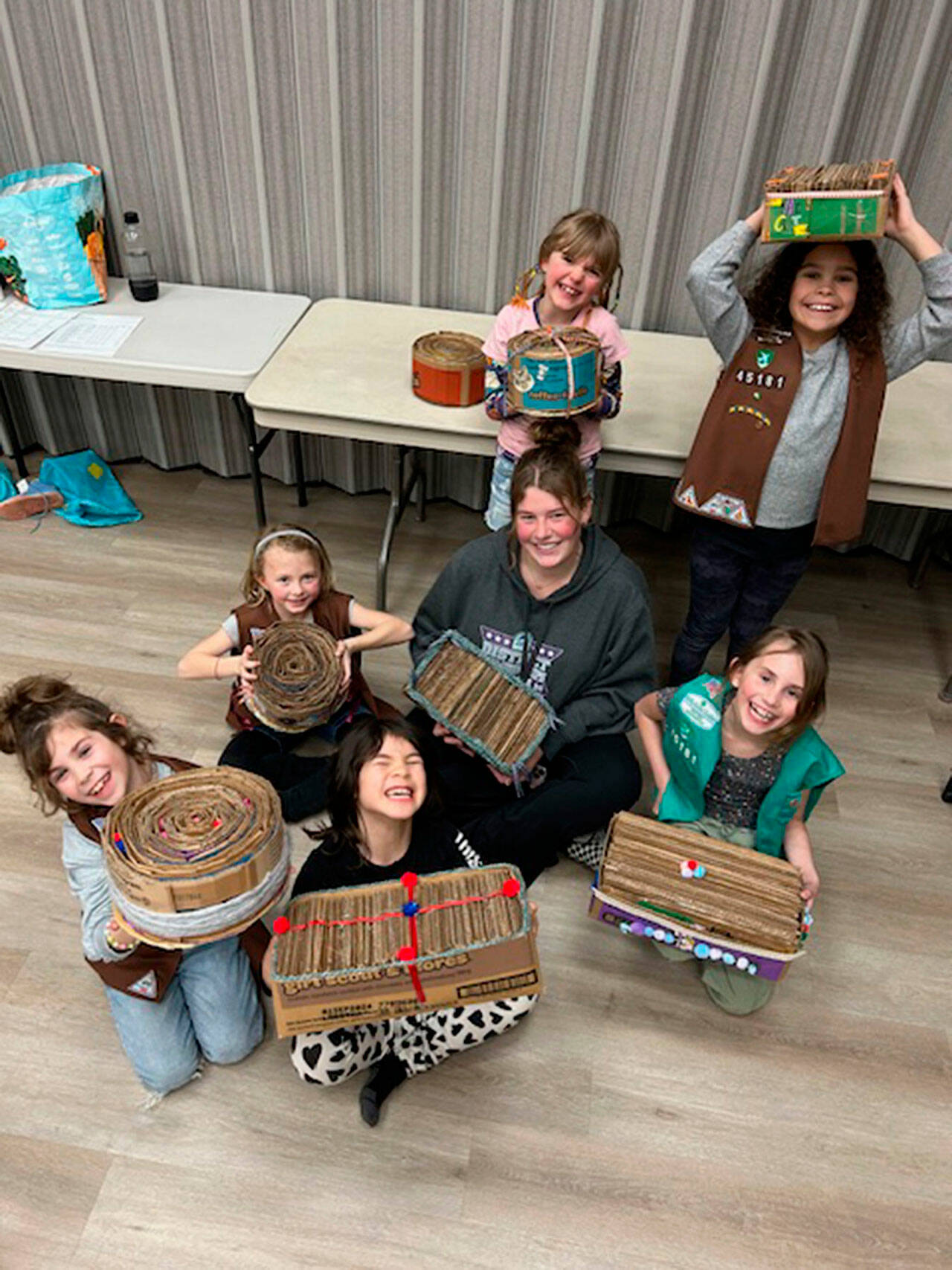 Photo courtesy Heidi Krzyworz
Girls Scouts with Troop 45181 complete making cat scratchers on March 6 from cookie boxes for Kitty City. Scouts include, from back left, Iris Carlquist-Bundy, Indira Reichner; center left, Malta Bushy, Skylar Krzyworz; front left, Lena Hanshaw, Sammy Nicholson, and Ember Hanshaw.