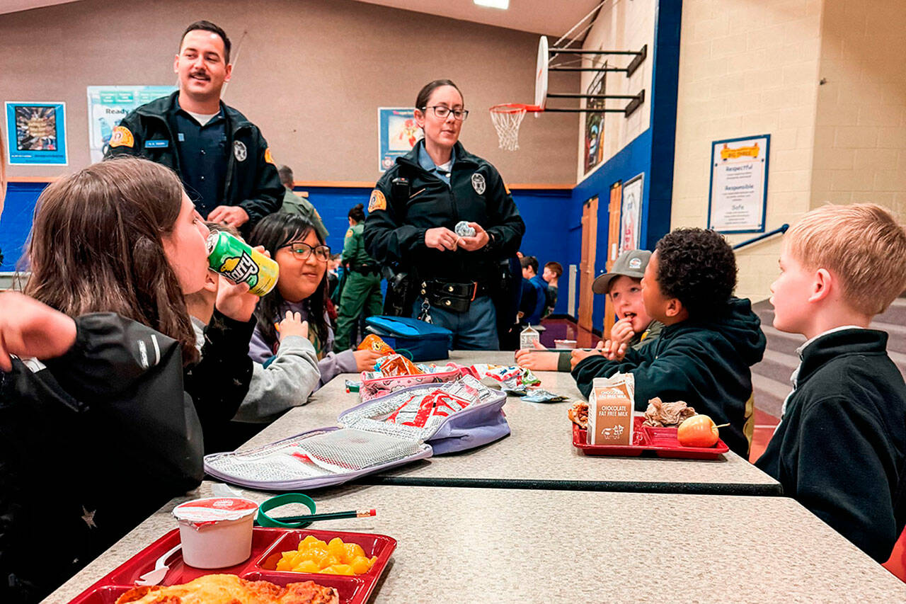 Photos courtesy Sequim Elementary PTA
Trooper Katherine Weatherwax with Washington State Patrol speaks to Helen Haller Elementary fourth graders at lunch about her job during Friend a First Responder Day.