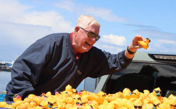 Gary Reidel, representing Wilder Toyota, plucks the winning duck from a truck. Wilder sponsored the winners prize of a 2024 Toyota Corolla. And the winner is Sarah Aten of Port Angeles. Her response was, “That’s amazing, that’s amazing.” There was 28,764 ducks sold this year as of race day. The all-time high was back in 2008 when over 36,000 were sold. (Dave Logan/For Peninsula Daily News)