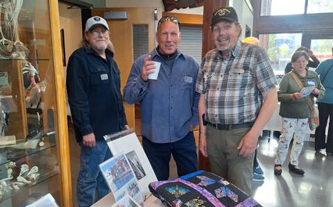 Photo courtesy of Sarge’s Veteran Support / Sarge’s Veteran Support house managers (from left) Danny Deckert, David Durnford and Steve Elmelund welcome attendees to the organization’s first fundraiser at the Dungeness River Nature Center on April 27. The event raised nearly $50,000.