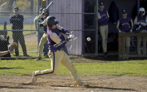 Sequim Gazette photo by Michael Dashiell / Sequim’s Lincoln Bear rips a single in the bottom of the fourth inning as the Wolves host Kingston on April 30.