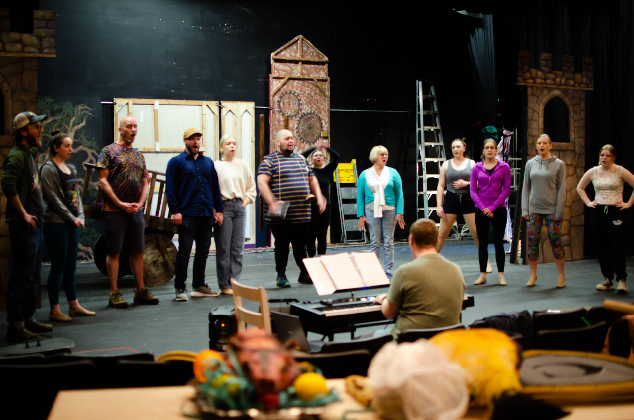 Sequim Gazette photo by Elijah Sussman / The ensemble cast fo “Spamalot” warm up their voices under the guidance of music director Morgan Bartholick-LeMaire at Olympic Theatre Arts on May 15.