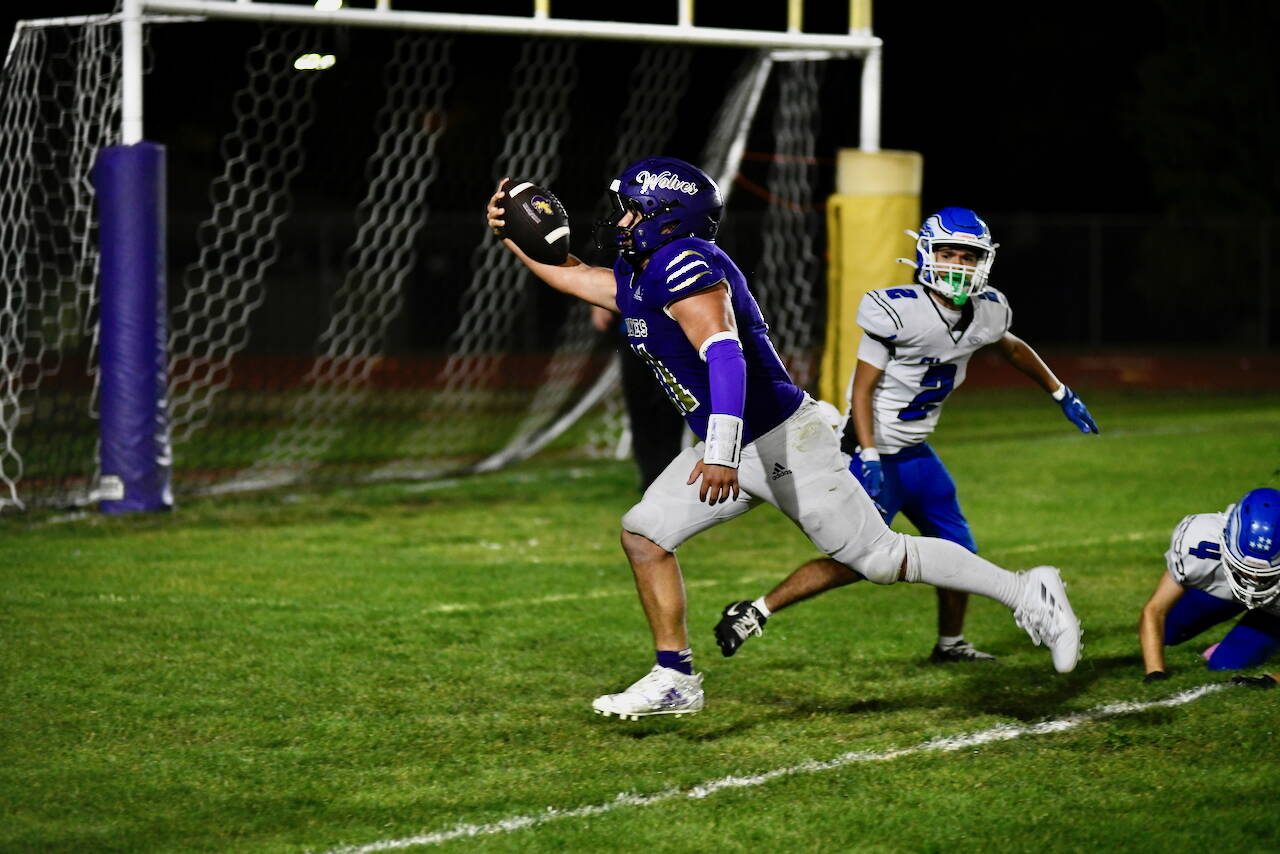 Sequim running back Liam Wiker celebrates after scoring on a 14-yard run against Elma on Friday. Sequim won 49-30. He had two touchdown runs in the win.