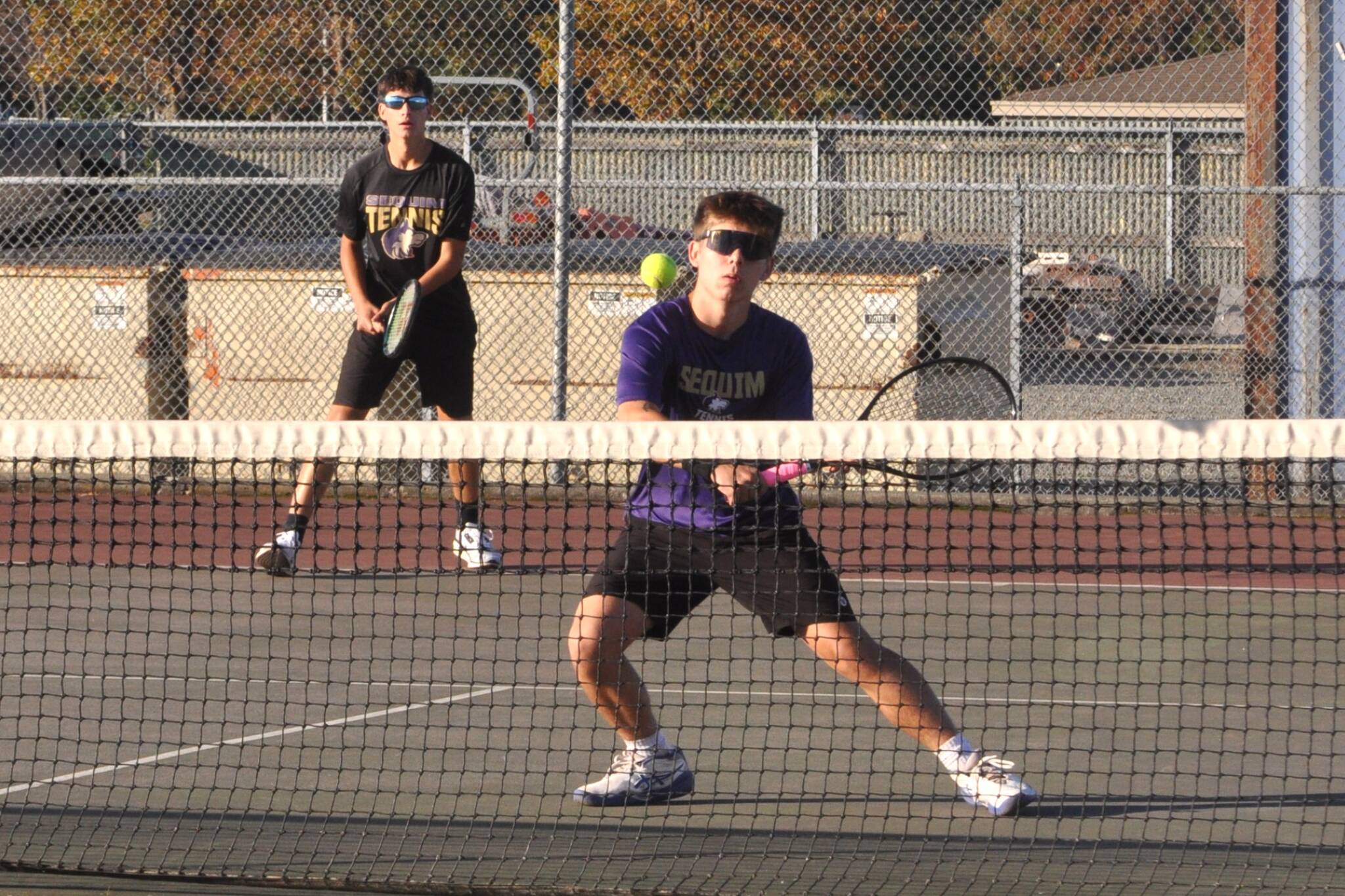 Sequim Gazette photo by Matthew Nash
Tegan Kurtze returns a hit as doubles teammate Sebastian Buhrer looks on in a match against Kingston players on Oct. 15.