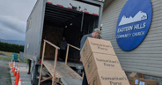 Photo courtesy Operation Christmas Child/ John Schvetz, central drop-off coordinator, hauls cartons of shoebox gifts into a truck headed for an Operation Christmas Child Processing Center, starting their journey to needy children around the world in 2024. He will do the same this year.