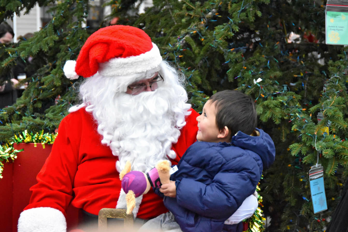 Sequim Gazette photo by Monica Berkseth/ Four-year-old Jaxon Kober of Sequim doesn’t hide his delight over the chance to visit with Santa by the community Christmas tree during Hometown Holidays in downtown Sequim on Saturday, Nov. 29.