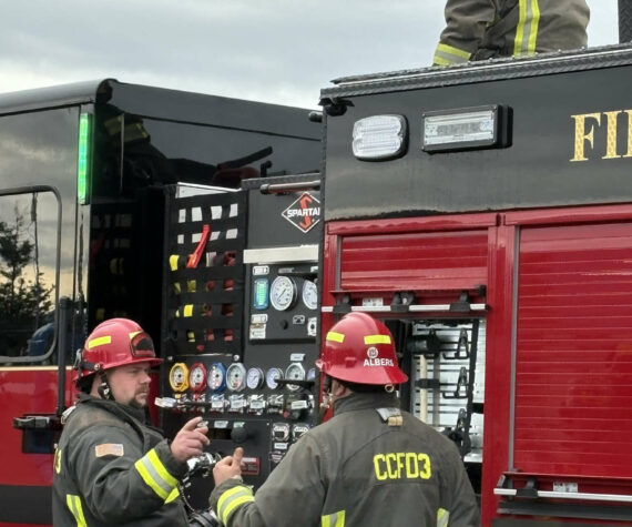 <p>Photo courtesy CCFD3</p>
                                <p>Captains Jeff Albers and Travis Anderson with Clallam County Fire District 3 discuss training on a new fire engine while Firefighter Ryan Hueter loads a hose.</p>