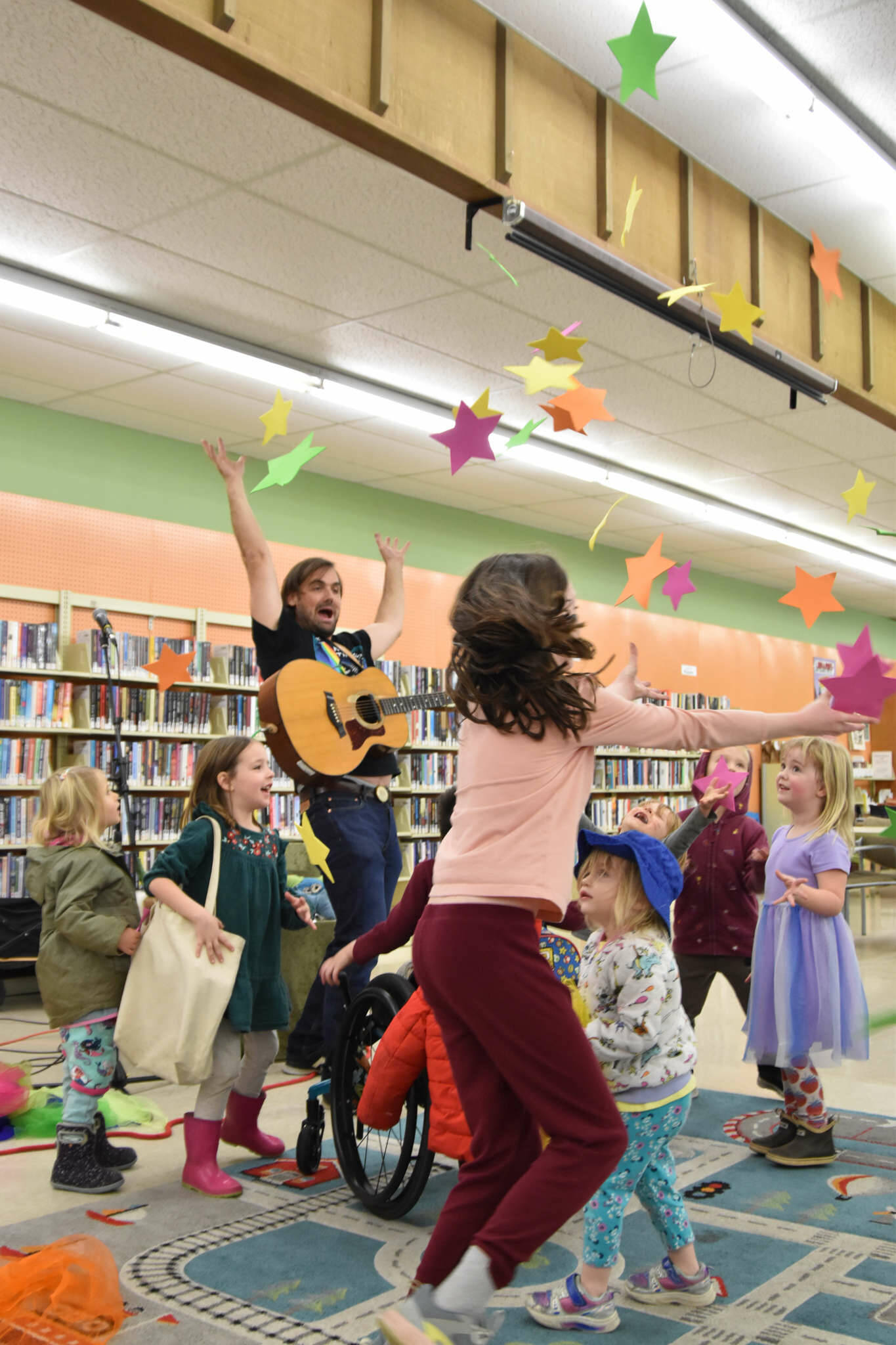 Sequim Gazette photo by Monica Berkseth/ Mikey the Rad Scientist was a hit with children at the Sequim Library on Saturday, Dec. 6, as he led them in songs and playful movements designed to spark curiosity about animals and ecosystsems. The North Olympic Library System (NOLS) sponsored the program for children ages 2-8 and their caregivers. For more information about NOLS programs for children and youth, visit <a href="https://NOLS.org/events" target="_blank">NOLS.org/events</a>, call 360-417-8500, or email youth@nols.org.