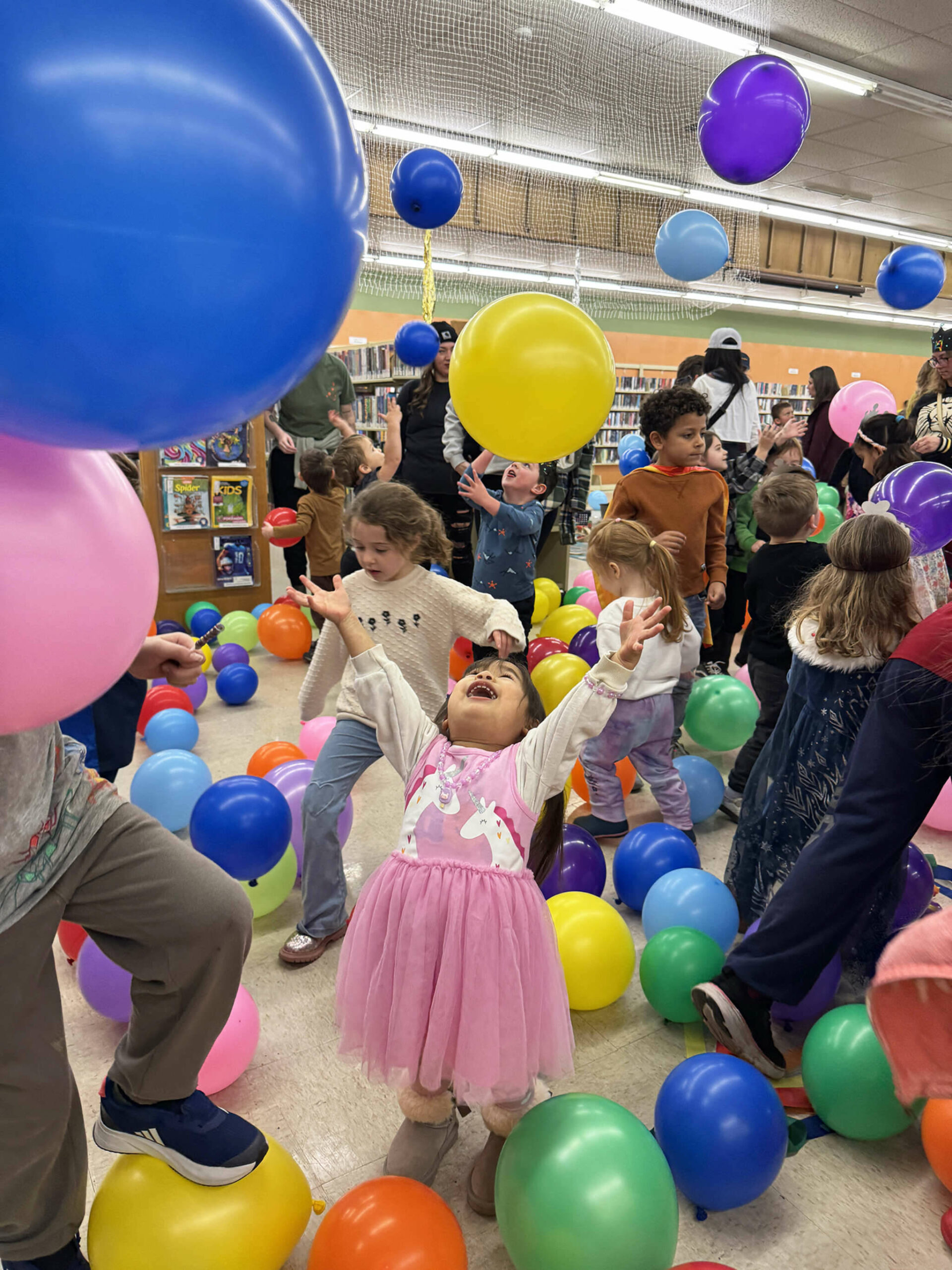 Photo courtesy Karyn Bocko/ The library is usually a place where patrons are expected to keep it down, but there was no shushing the crowd that turned out at the Sequim Library Temporary Location, 609 W. Washington St., on Wednesday, Dec. 31 for the Noon New Years Eve party hosted by the North Olympic Library System for children and their grown-ups. Tykes celebrated the upcoming new year with a balloon drop, crafts and dancing, Similar celebrations took place at the libraries in Forks and Port Angeles, funded by Friends of the Library groups.