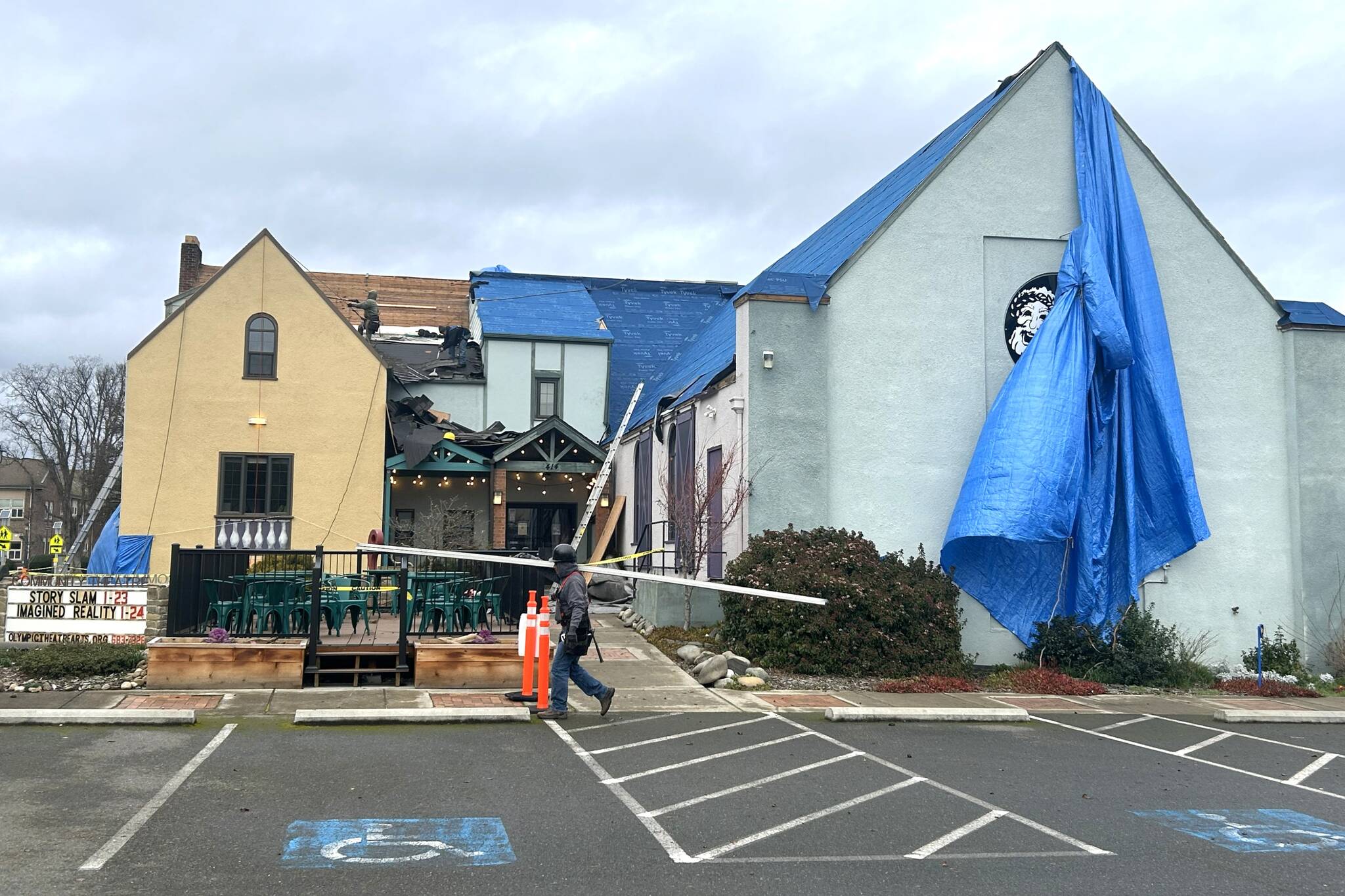 Sequim Gazette photo by Matthew Nash
Integrity Roofing and Construction started work last week to replace Olympic Theatre Arts roof. The theaters box office is closed through Jan. 19 until construction is finished.
