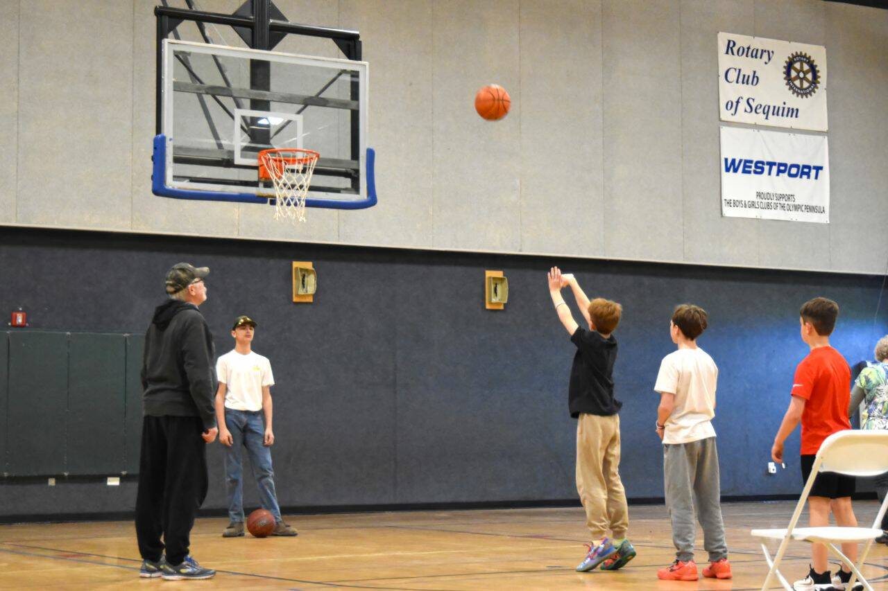 Sequim Gazette photo by Monica Berkseth/
Roman Bacchus shoots during the Elks Hoop Shoot on Jan. 10. He won the boys age 12-13 bracket and moves on to the district competition held Jan. 24 again held in Sequim.