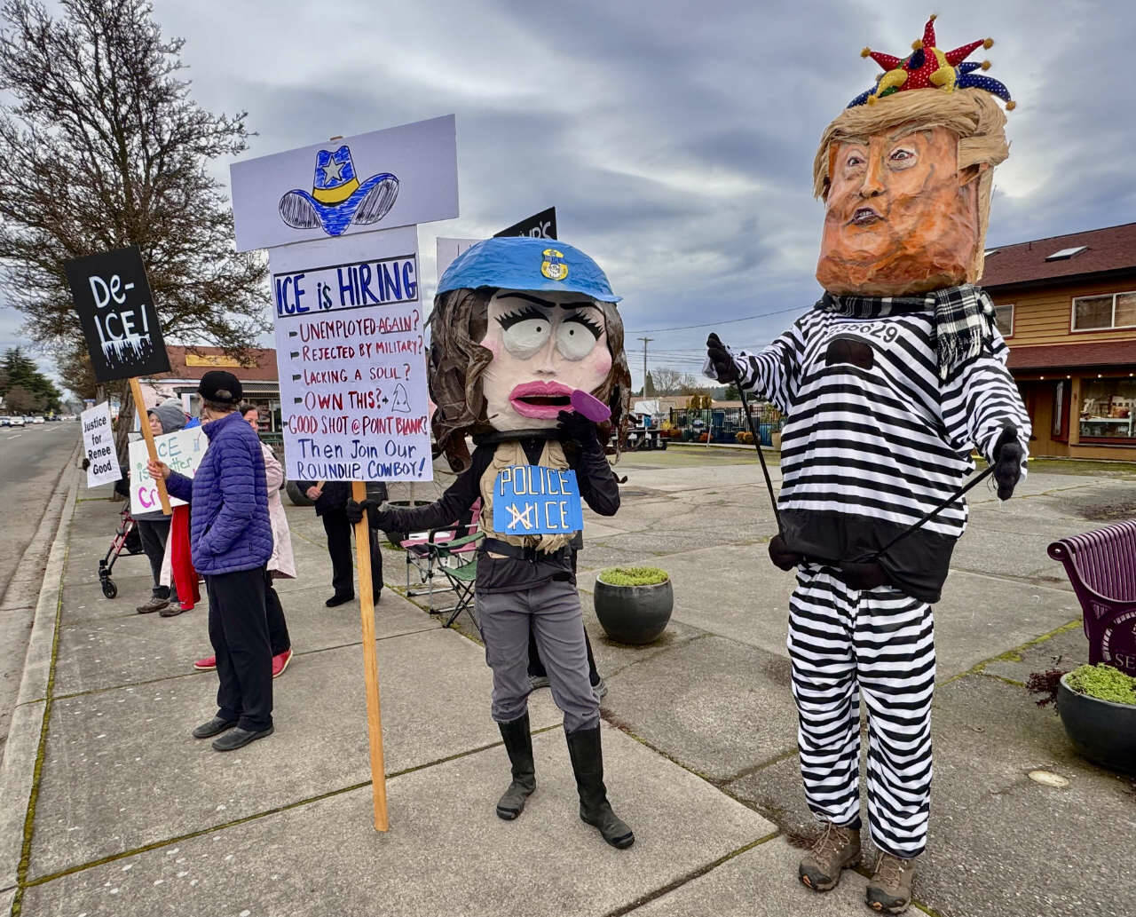Photo courtesy Indivisible Sequim/ Sequim Indivisibles hastily-organized protests over the weekend to denounce the killing of Minneapolis mother of three Renee Good by a U.S. ICE agent drew protestors wearing head gear designed to resemble United States Secretary of Homeland Security Kristi Noem and President Donald J. Trump.