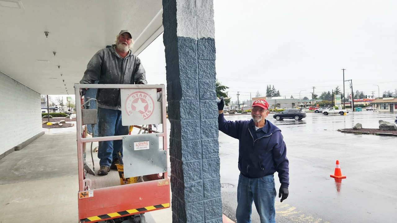 Photo courtesy Shipley Center 
Duane Cobb paints the new senior center site with the help of a volunteer.