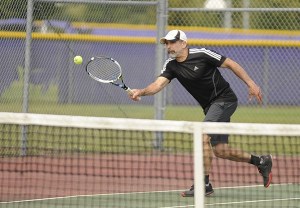 Julien Berg of Sequim returns a shot at Saturday’s tournament. Berg won top honors at the event.