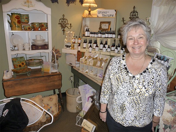 Marcella Stachurski stands near a display of Cedarbrook’s own bath and body products.